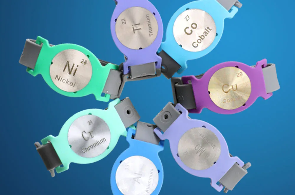 Sensiband wristbands with nickel, titanium, cobalt and other metal discs used to screen for implant metal sensitivity.