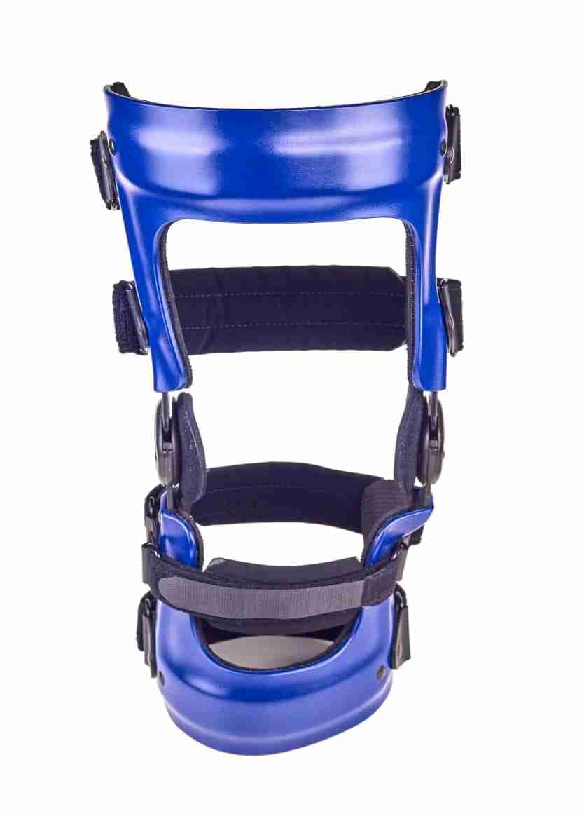 A blue unloader knee brace used to shift weight off the arthritic side of the knee.