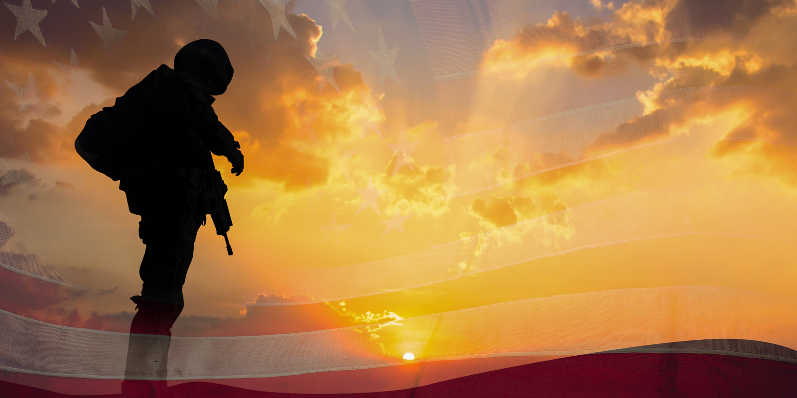 Silhouette of a soldier against a sunset blended with the American flag.