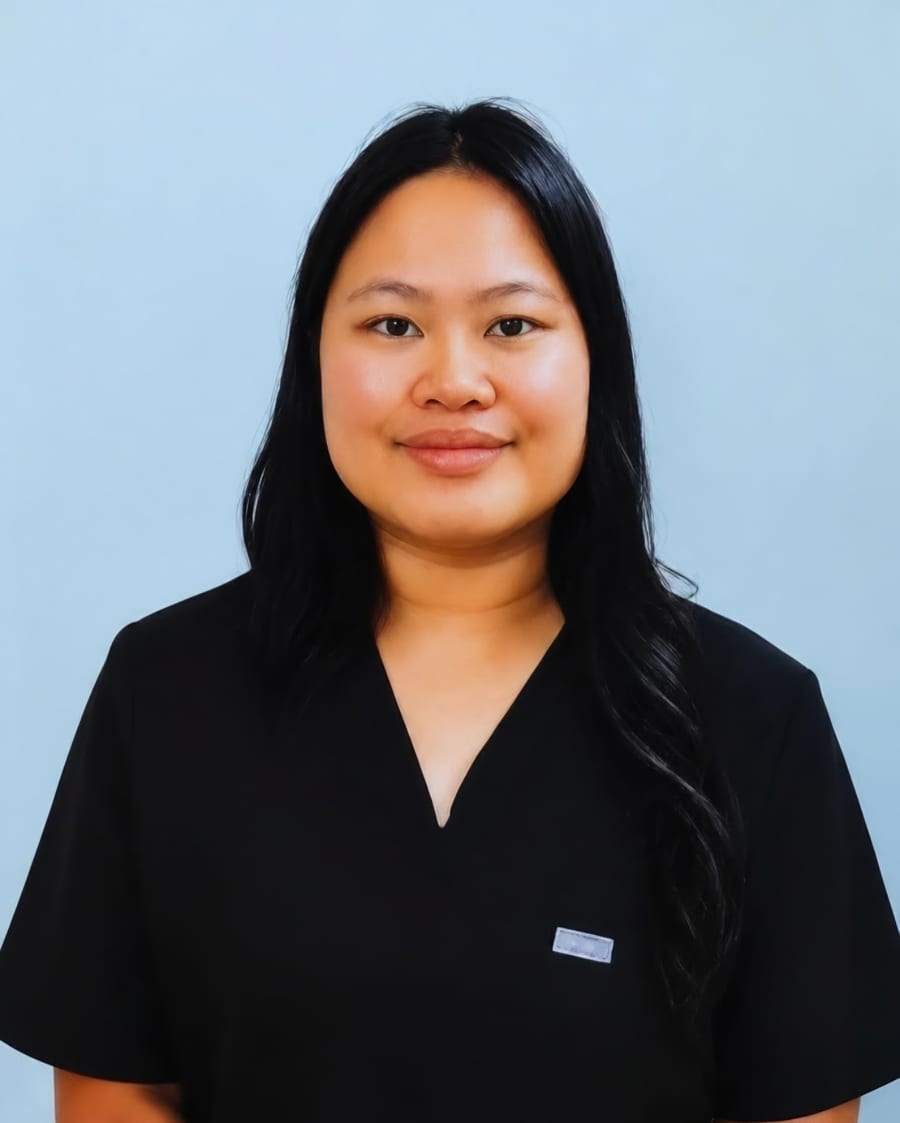 Riana Esmena-Faria, a member of the Pacific Bone & Joint team, in black scrubs.